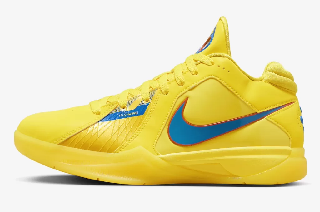 A yellow Nike KD 3 sneaker with a blue Swoosh and orange accents.
