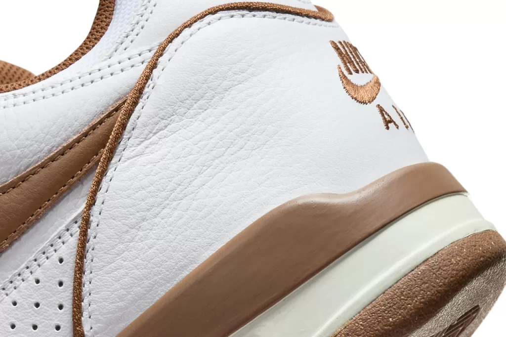 This colorway blends a clean white leather upper with rich pecan brown accents, creating a warm and earthy aesthetic. The snakeskin overlays add a touch of texture and sophistication, while the Air Jordan 4-inspired sole provides a touch of retro charm.
