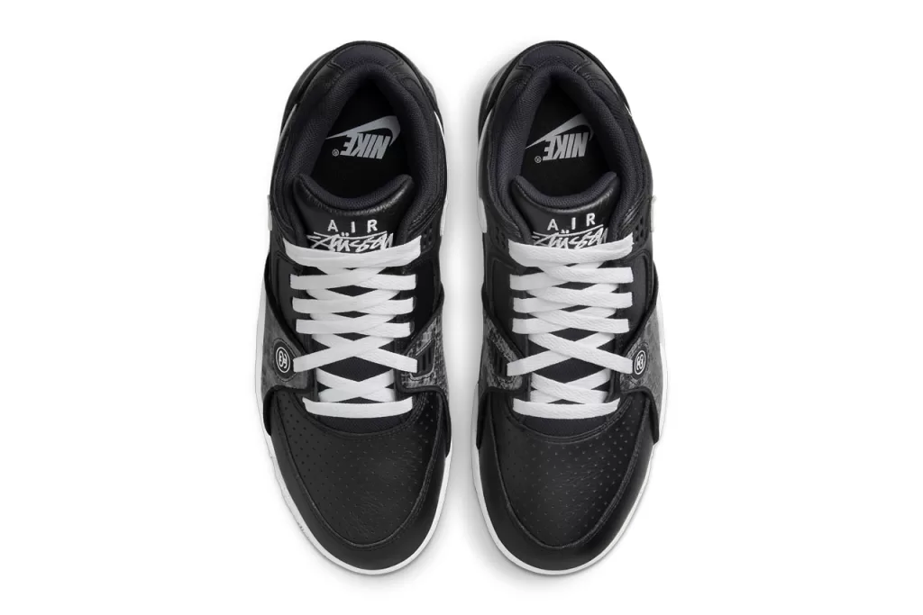 A timeless combination of black and white, this colorway exudes a sophisticated yet understated vibe. The black leather upper is complemented by white Swooshes, tongue, and heel tab, while the snakeskin overlays provide a subtle hint of texture. The Air Jordan 4-inspired sole completes the look with a touch of retro flair.
